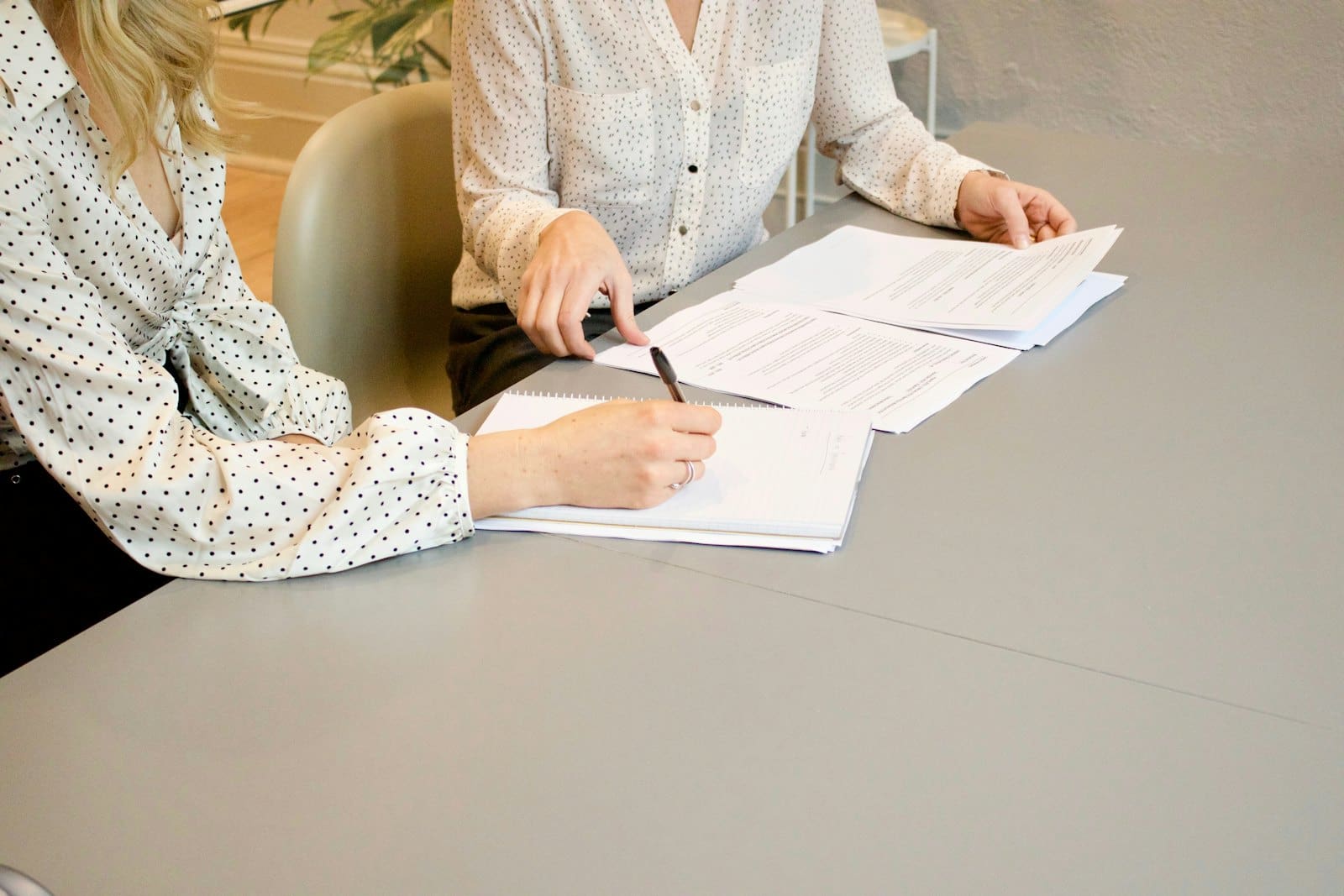 Paperwork and a pen on a desk, representing estate planning and pensions